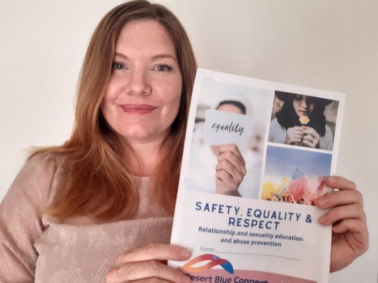 Ms O’Malley with the Safety, Equality and Respect booklets she developed for the SHINE AND SHIMMER girls